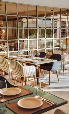 a dining room with a table and chairs at Status-M Apartments 89 in Becici