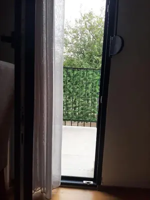 an open door with a view of a balcony at Apartment Podgorica in Podgorica