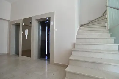a hallway with stairs and a door in a building at PREMIUM Tre canne apart 