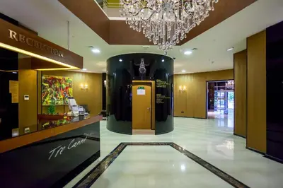 a large lobby with a chandelier in a building at Two rooms in Tre canne hotel in Budva