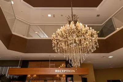 a chandelier hanging from the ceiling of a hotel at Luxury one bedroom apartment in beachfront apart Hotel in Budva