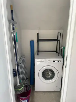 a washer and dryer in a small room at Sutomore Panorama Apartment in Sutomore
