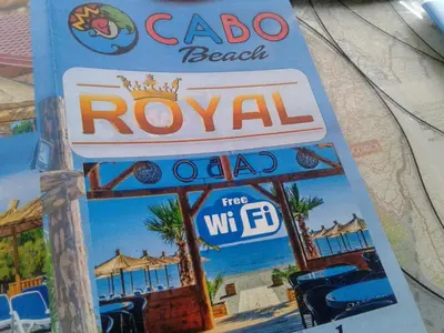 a sign for aroolani restaurant on a pole at Apartmen Donji Stoj in Donji Štoj