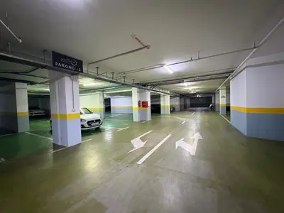 an empty parking garage with a car parked in it at The Royal Suite - Tre Canne in Budva