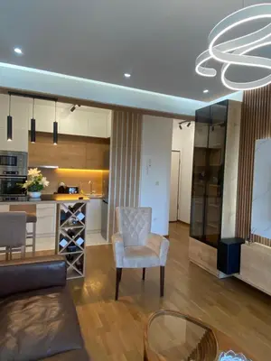 a living room with a couch and a chair and a table at Rent a apartment Podgorica in Podgorica
