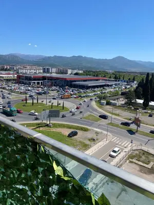 a view of a city with a parking lot at Rent a apartment Podgorica in Podgorica