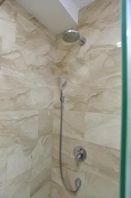 a shower with a shower head in a bathroom at PREMIUM Tre canne apart 