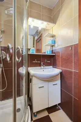 a bathroom with a sink and a shower at Mik Apartments Heart of Budva 1 plus 1 40 SqMeter in Budva