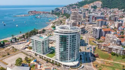 an aerial view of a city and the ocean at Luxury 3 bedroom flat in Tre canne hotel next to the beach in Budva