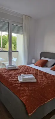 a bedroom with two beds with towels on top of them at Zira2 in Kotor