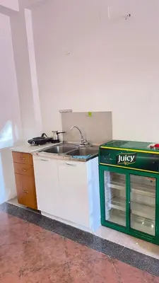a kitchen with a sink and a counter top at Hostel Flash in Ulcinj
