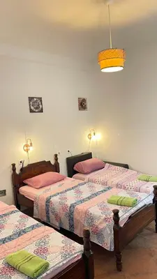 a bedroom with two beds and a light at Hostel Flash in Ulcinj