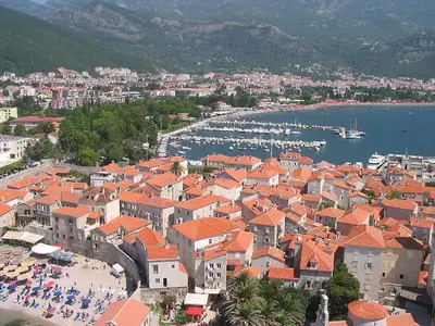 an aerial view of a town with boats in the water at Status-M Apartments Rozino in Budva