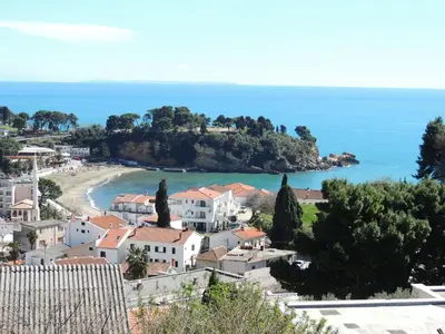 a view of a village and a beach at Guest House Djakonovic in Ulcinj