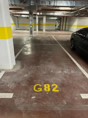 a parking garage with a car parked in it at Stylish one bedroom apartment Central Point with -GARAGE 5 EUR PER DAY in Podgorica