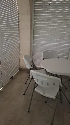 a meeting room with two tables and two chairs at Guest apartment Mina in Ulcinj