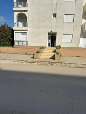 a building with stairs leading to a door at Guest apartment Mina in Ulcinj