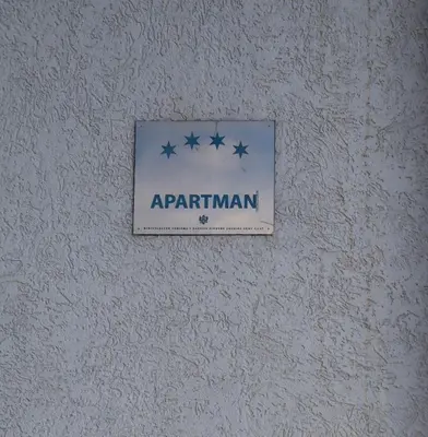 a sign on a wall with stars on it at Apartmani MULIC Sutomore in Sutomore