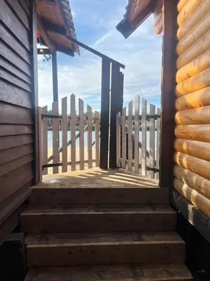 a stairway leading up to a building with a fence at Suncica Ada Bojana in Ada