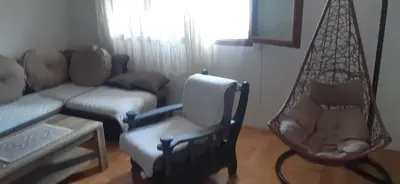 a living room with a couch and a chair at Apartman Marko in Podgorica