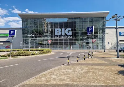 a large building with a big sign on it at Stex Prime City Kvart in Podgorica