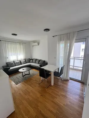 a living room with a couch and a table at Nema 2 in Kravlja