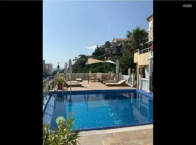 a large swimming pool in the middle of a house at Apartment Anja in Dobra Voda