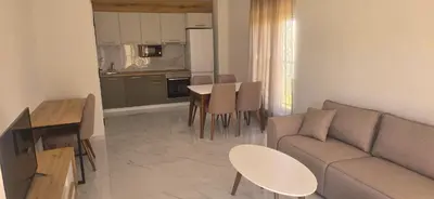 a living room with a couch and a table at Apartmani Banović 3 - Ulcinj, Velika plaža in Ulcinj