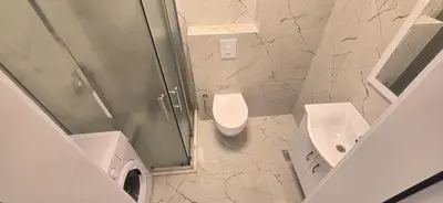 a bathroom with a shower and a toilet and a sink at Apartmani Banović 2 - Ulcinj, Velika plaža in Ulcinj