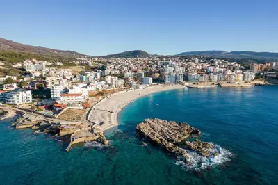 an aerial view of a beach with buildings and the ocean at Veliki Pijesak One Bedroom Apartment in Dobra Voda