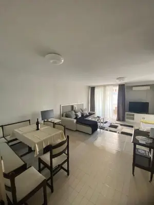 a living room with a couch and a table at Centar, Kosta apartment in Bar