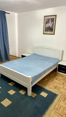 a bed in a room with a blue mattress at Jelena apart Budva in Becici