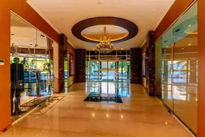 a hallway of a building with a chandelier at Apartment TC Lux VLSB in Budva