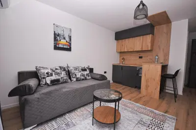 a living room with a couch and a kitchen at New Studio - Dobra Voda in Dobra Voda