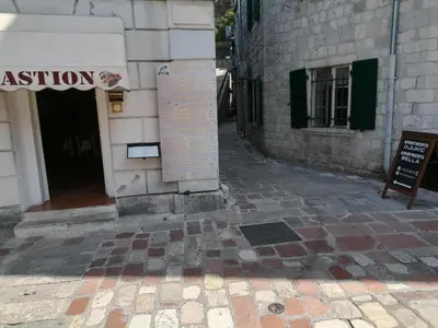 a sign on the side of a building at sar 3 in Kotor