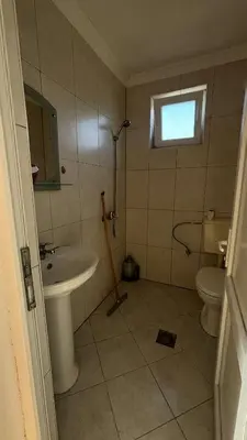 a bathroom with a sink and a toilet at Apparteman in Ulcinj
