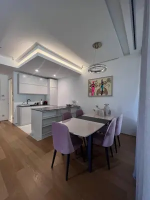 a kitchen and dining room with a table and purple chairs at Dukley Retreat, Serenity Collection in Budva