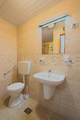 a bathroom with a toilet and a sink at Studio Maris in Budva