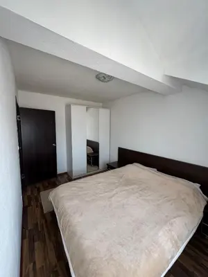 a bedroom with a large bed in a room at Duplex apartment in Podgorica in Podgorica