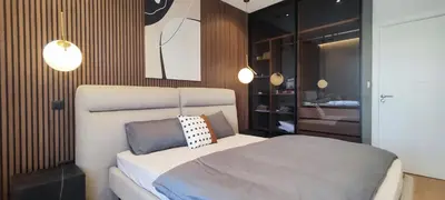 a bedroom with a large bed in a room at Stylish City Living Elegant One Bedroom Apartment in Podgorica