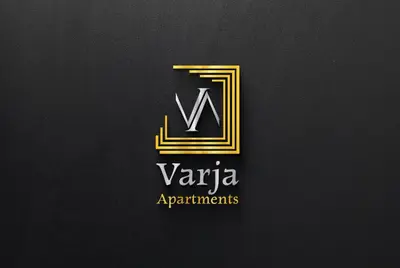 a logo for a company with a letter v in gold at Apartments Varja in Sveti Stefan