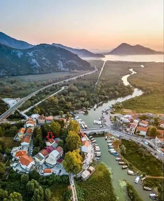 an aerial view of a river with houses and boats at Apartment Vukasevic in Virpazar