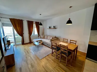 a living room with a couch and a table at Apartmants City Love in Podgorica