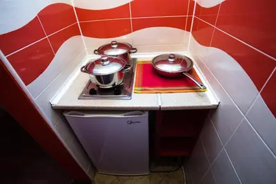 a small kitchen with two pots on a counter at Villa Elkom, App.9 in Ulcinj