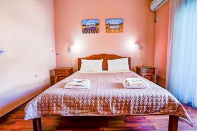 a bedroom with a bed with two towels on it at Villa Elkom, Ap 15 in Ulcinj