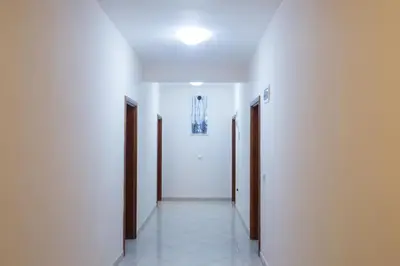 an empty hallway with two doors and a hallwayngthngthngthngthngthngthngth at Villa Elkom, App 16 in Ulcinj