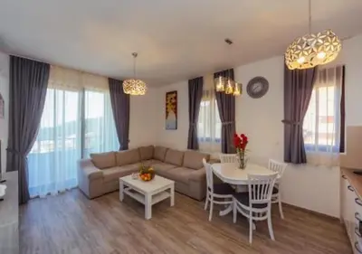 a living room with a couch and a table at Engora 5 in Petrovac na Moru