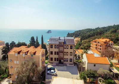 an aerial view of a town with houses and the ocean at Engora 5 in Petrovac na Moru