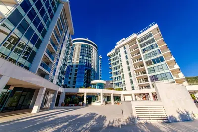 a group of tall buildings in a city at Tre Canne Red Bull in Budva