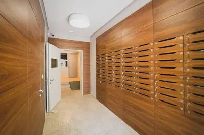 a walk in closet with wood panels and a hallway at Apartment Andrea in Budva